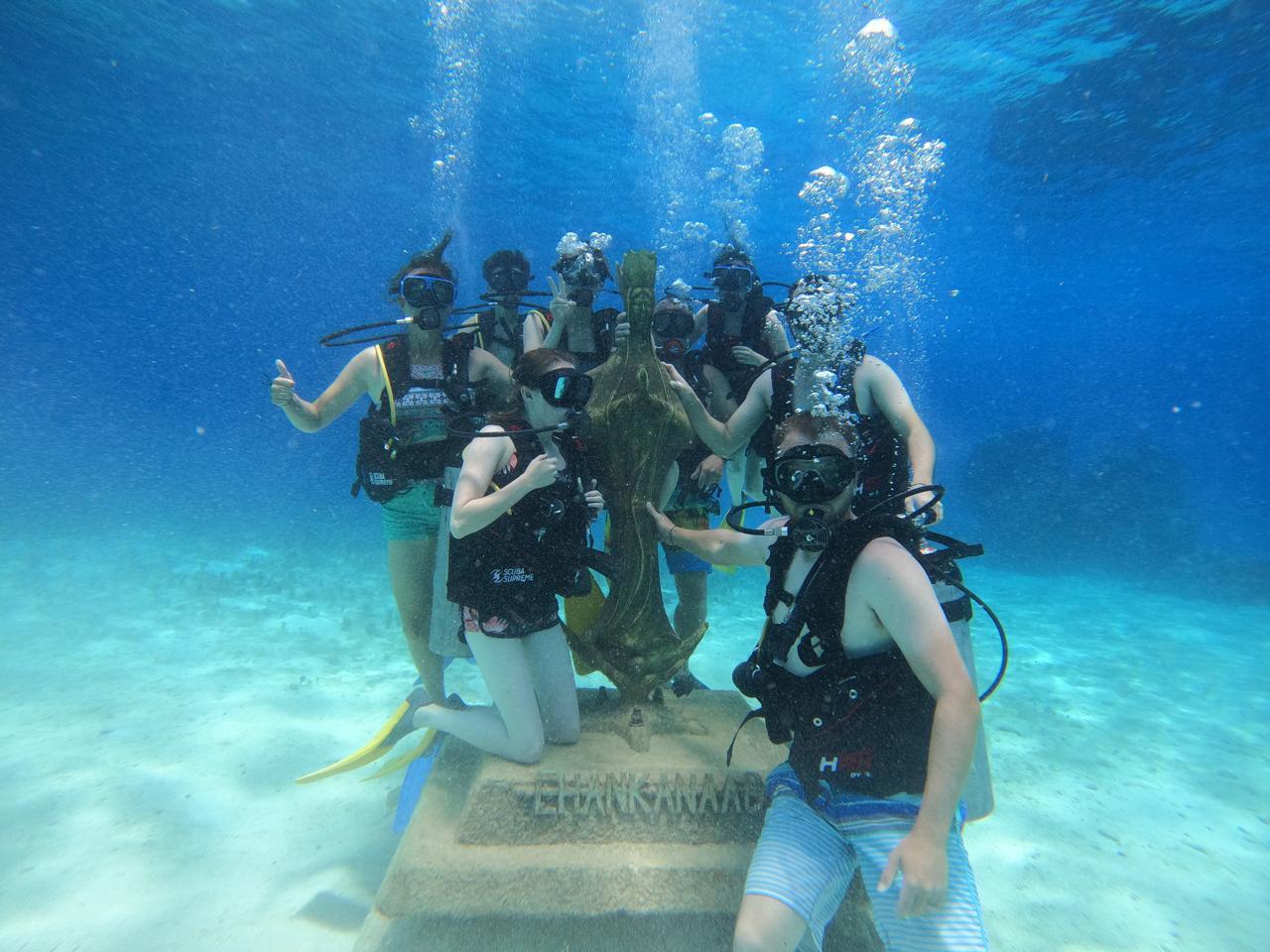 Divers at the underwater sculpture in Chankanaab